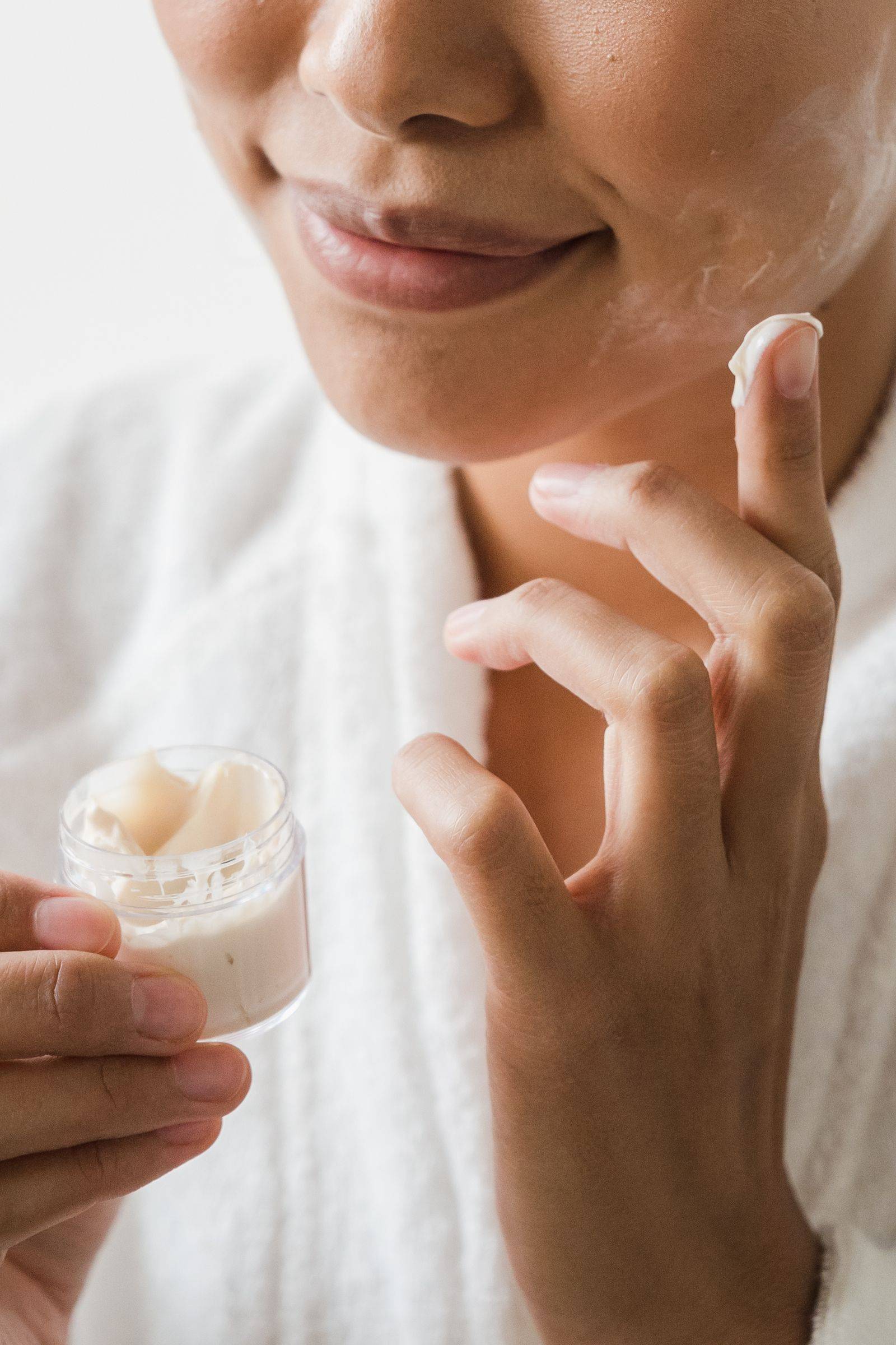 A morning skincare ritual in soft, natural light.